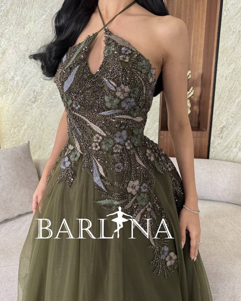 Olive green dress with shiny embroidery and front slit