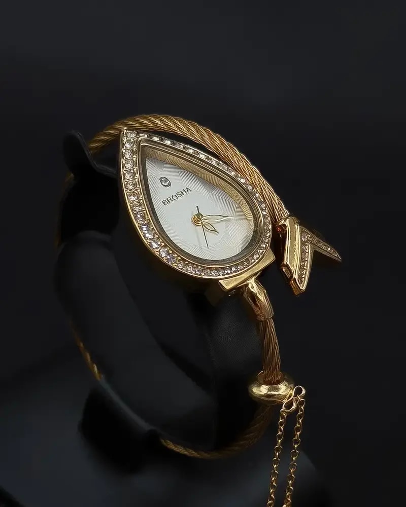 Teardrop-shaped wristwatch adorned with sparkling crystals