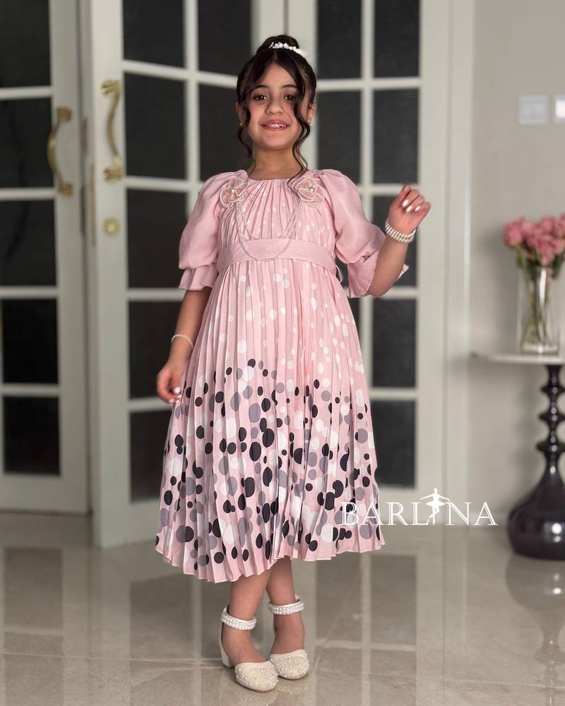 Girls' pink dress with elegant polka dot details