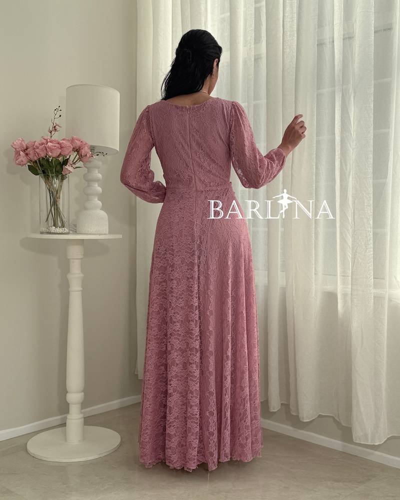 Pink lace dress with a crisscross wrap design