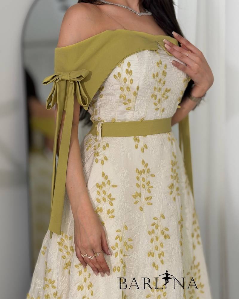Off-white dress with olive-green floral patterns