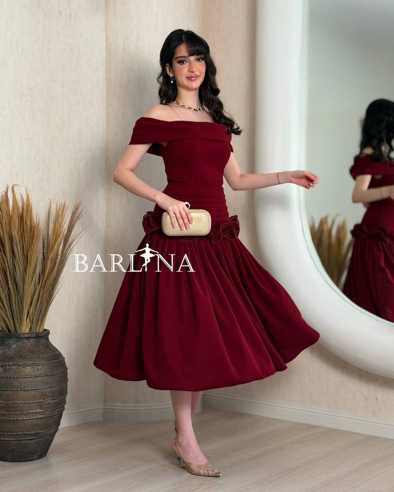 Burgundy dress with ruffles at the waist