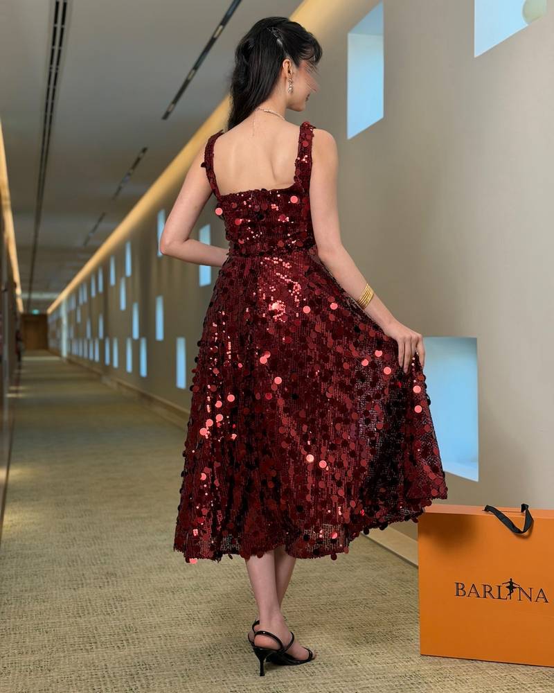 Burgundy sequined midi dress with a feminine cut