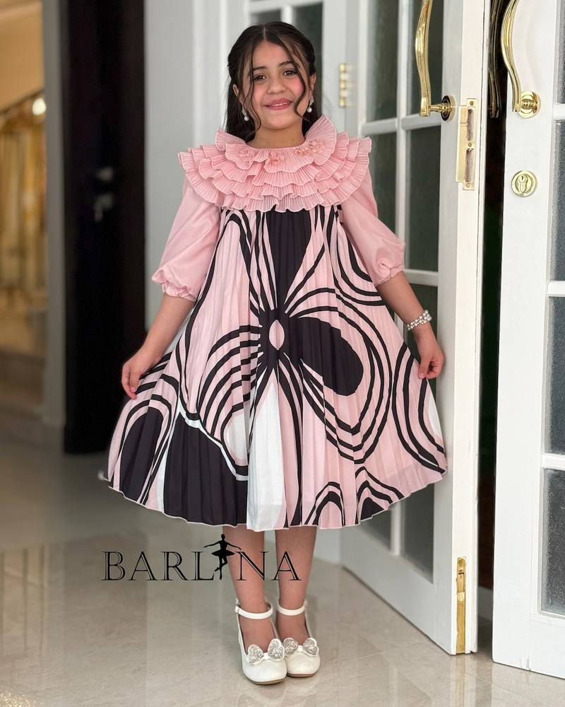Girls' dress with a ruffled top and a modern pattern