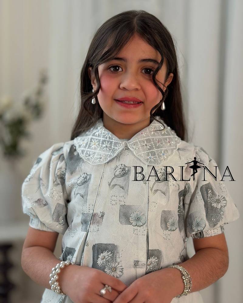 Girls' dress decorated with printed patterns