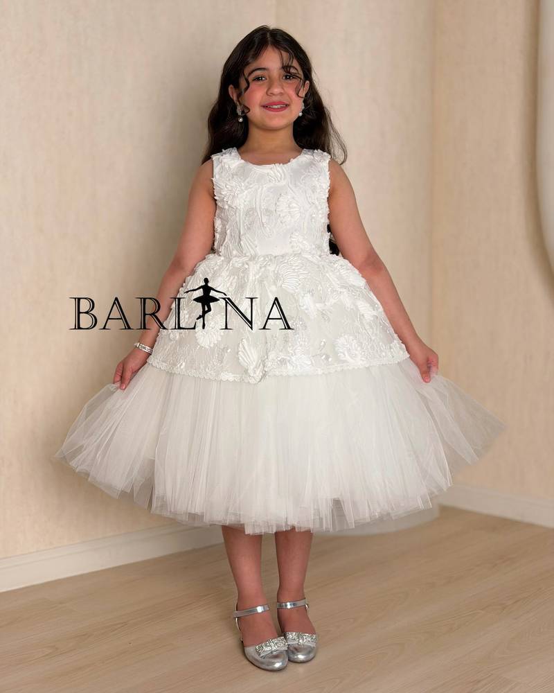 White girl's dress with prominent lace details