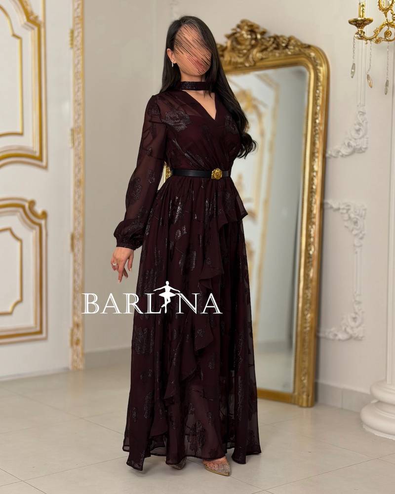 A burgundy floral dress with a gold belt