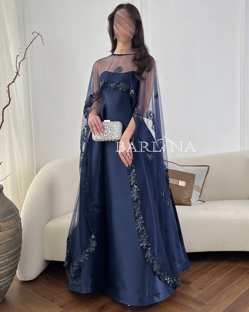 Long navy blue evening dress with a transparent cape