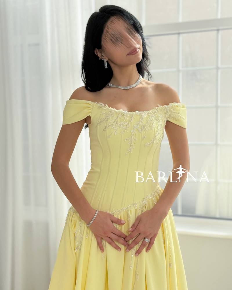 Yellow off-shoulder dress with a fitted corset