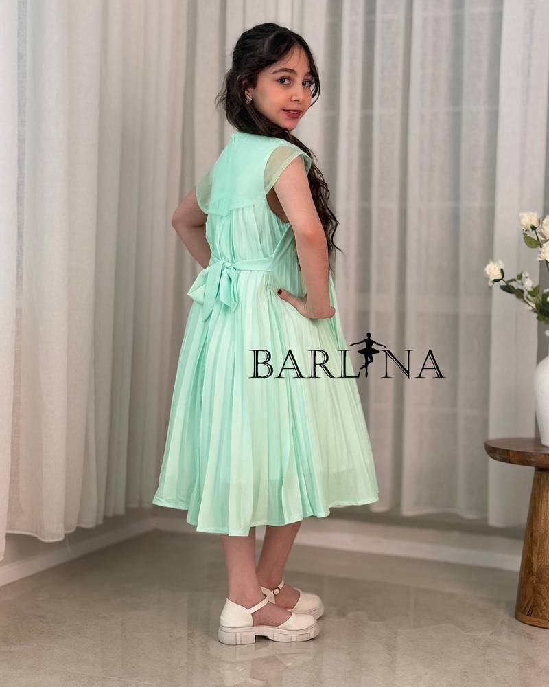 A soft girl's dress with floral embroidery