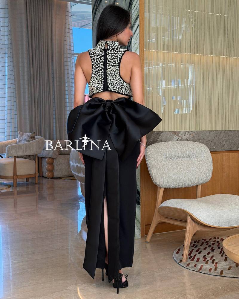Long black dress with a neckline embroidered with crystals