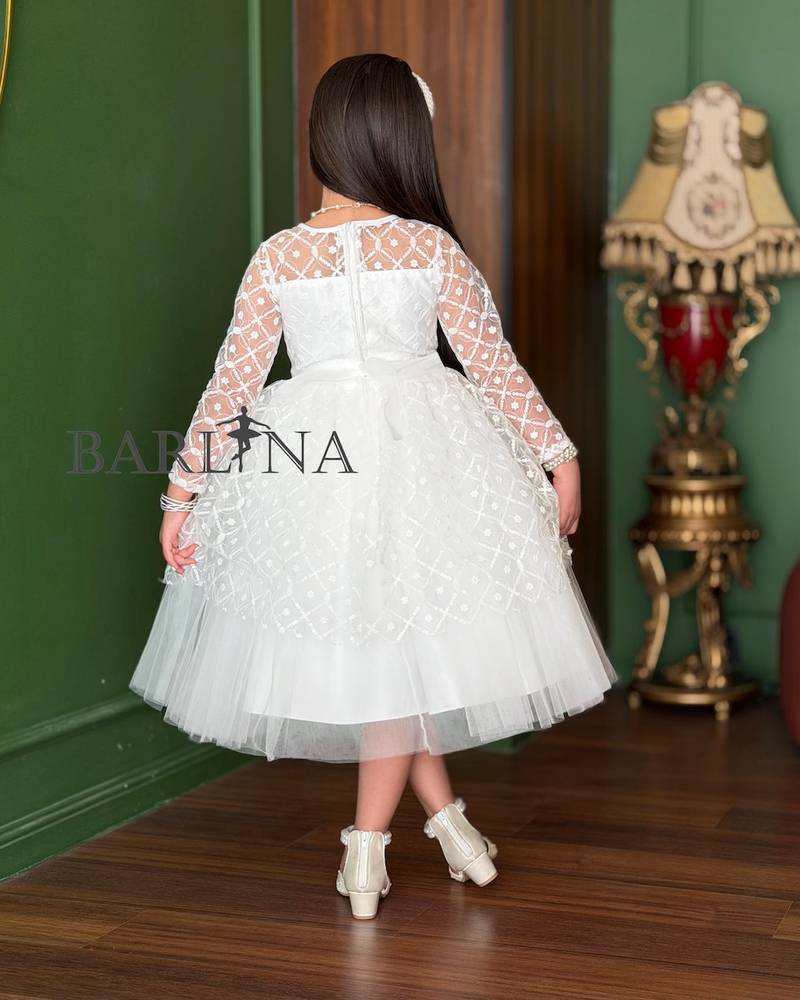 white girl's dress with sheer decorative sleeves