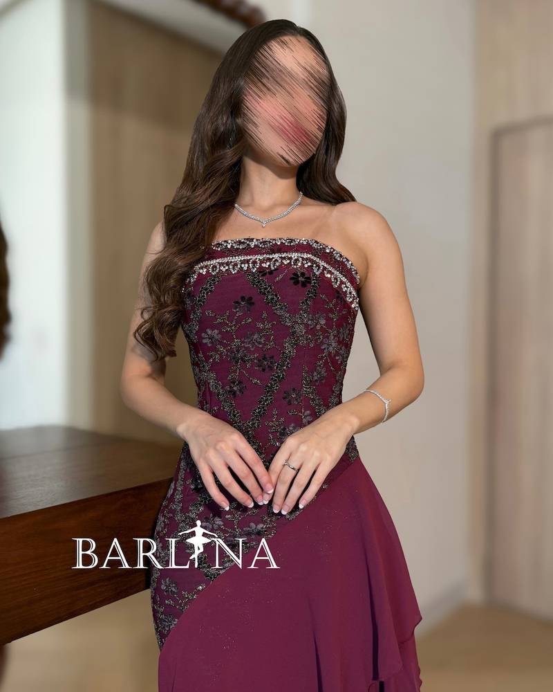 Burgundy dress with soft layers and an asymmetrical hem