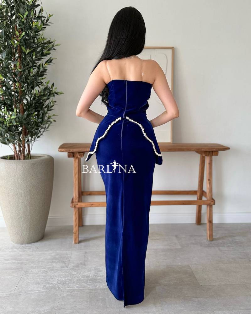Navy velvet dress embellished with shimmering pearls