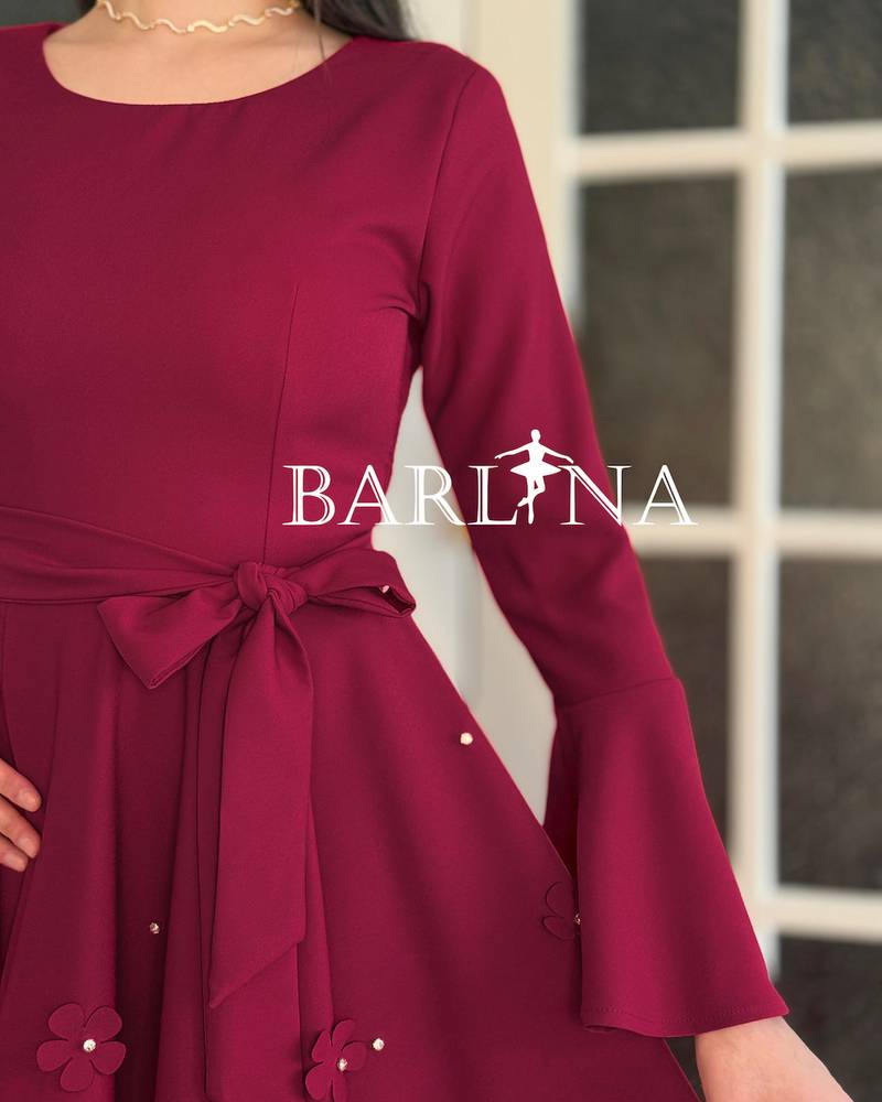 A stylish fuchsia dress with delicate embroidery