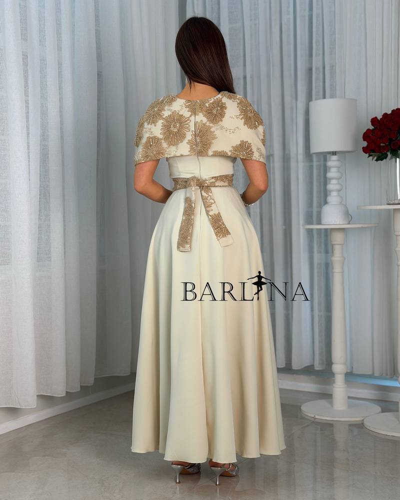Soft beige dress with a layer embroidered with gold embroidery