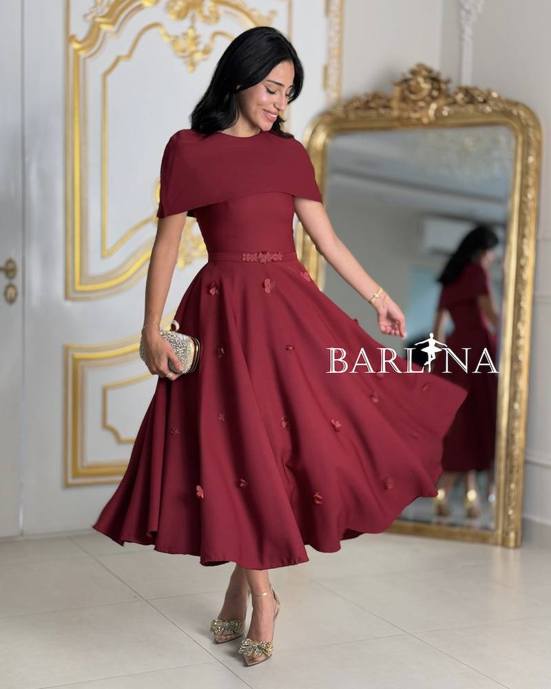 Loose burgundy dress with a covered neckline