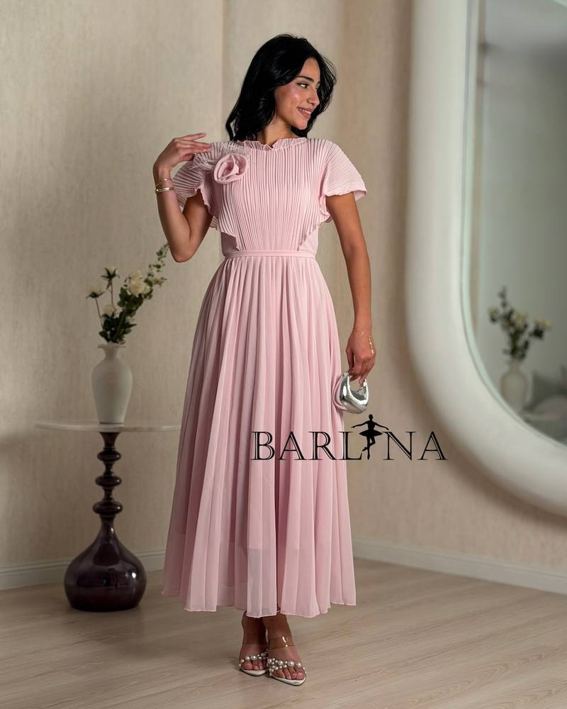 Pink pleated midi dress with a side rose