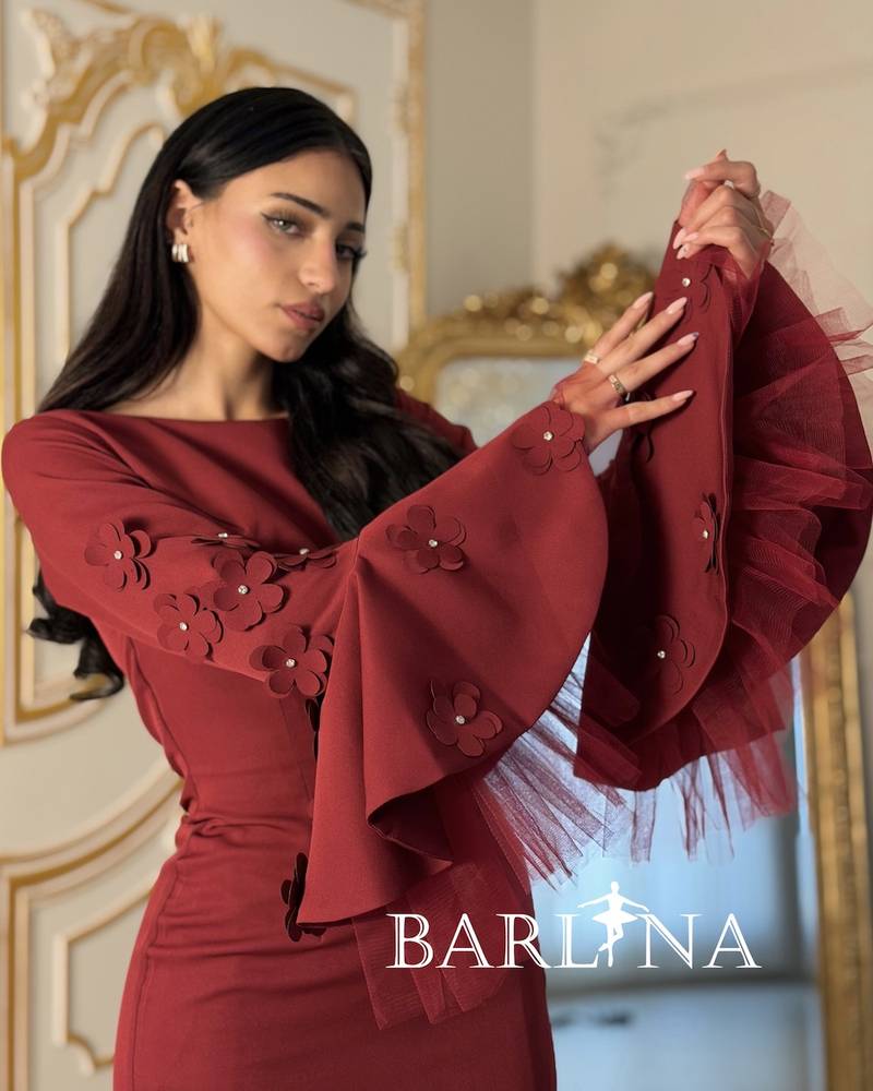 Burgundy dress with wide sleeves adorned with roses