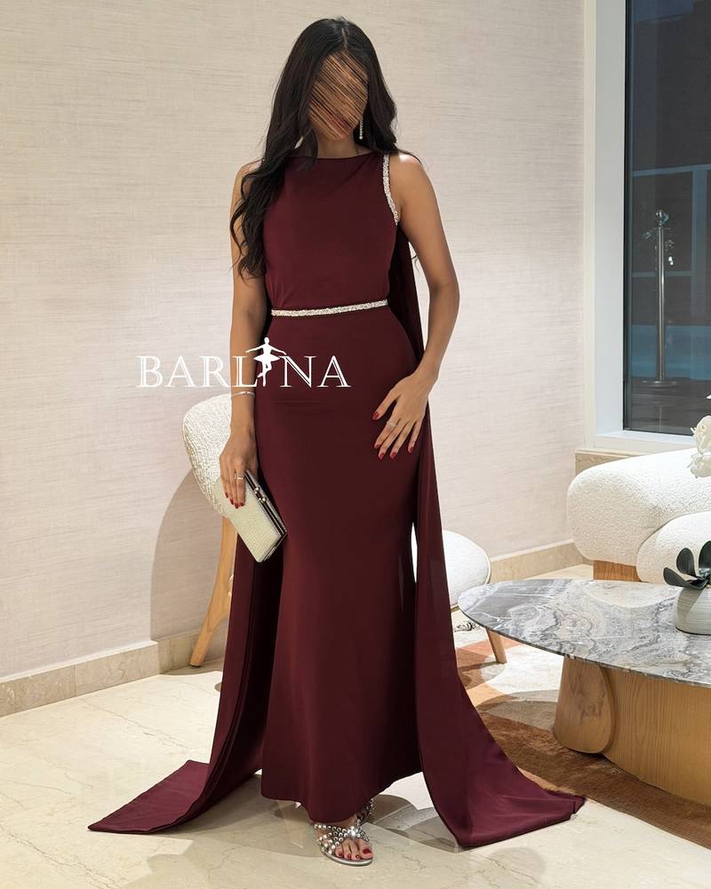 A luxurious burgundy dress with shimmering details