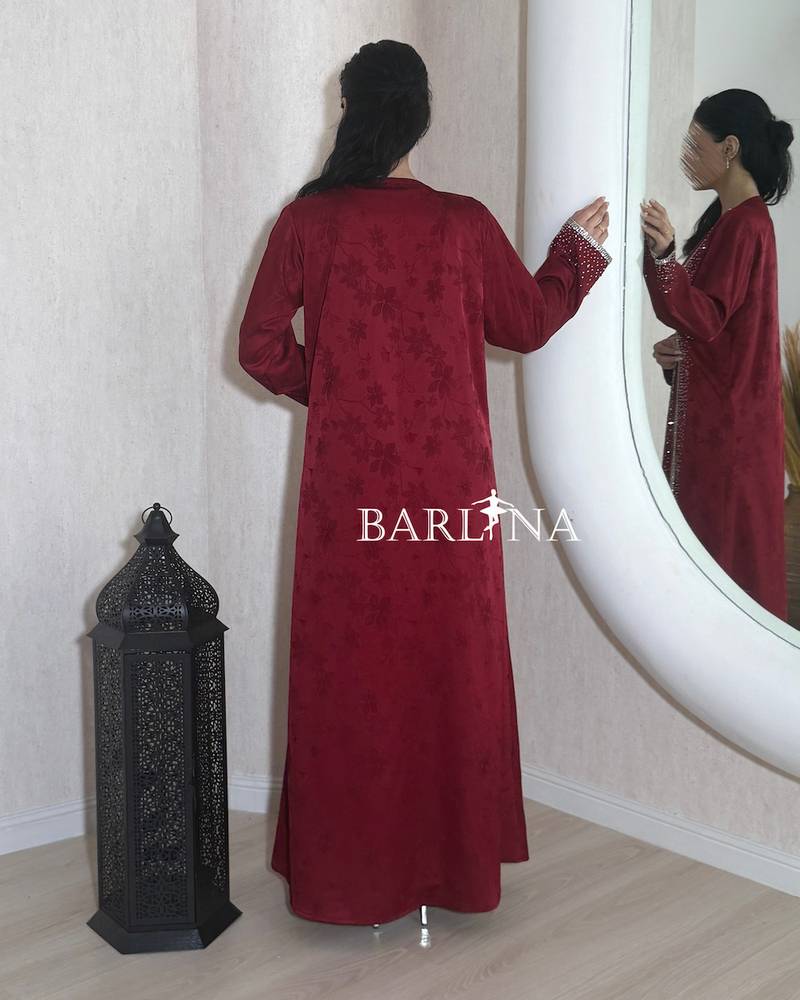 A soft maroon jalabiya with external embroidery
