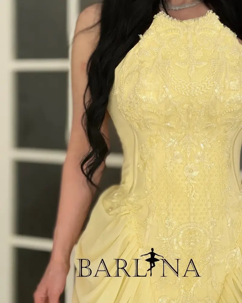 Yellow dress with delicate embroidery and ruffle details