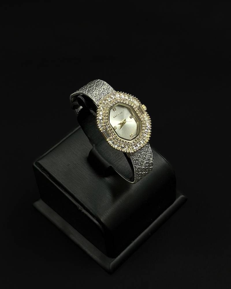 Womens watch with an oval bezel fully studded