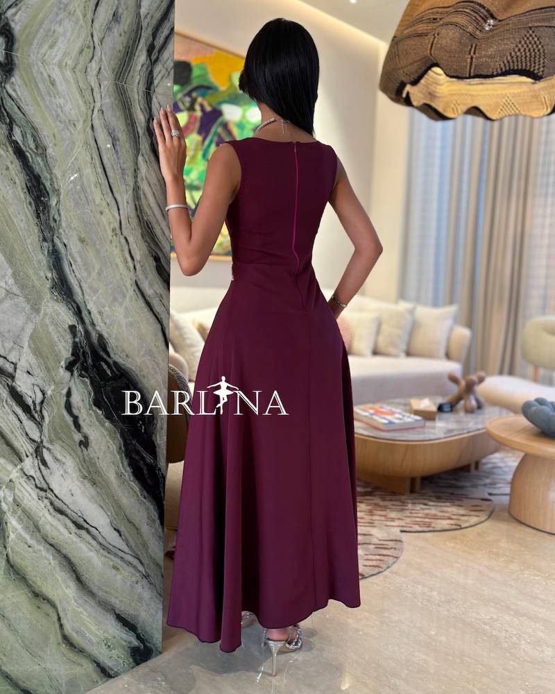 berry-toned dress adorned with a crystal curve