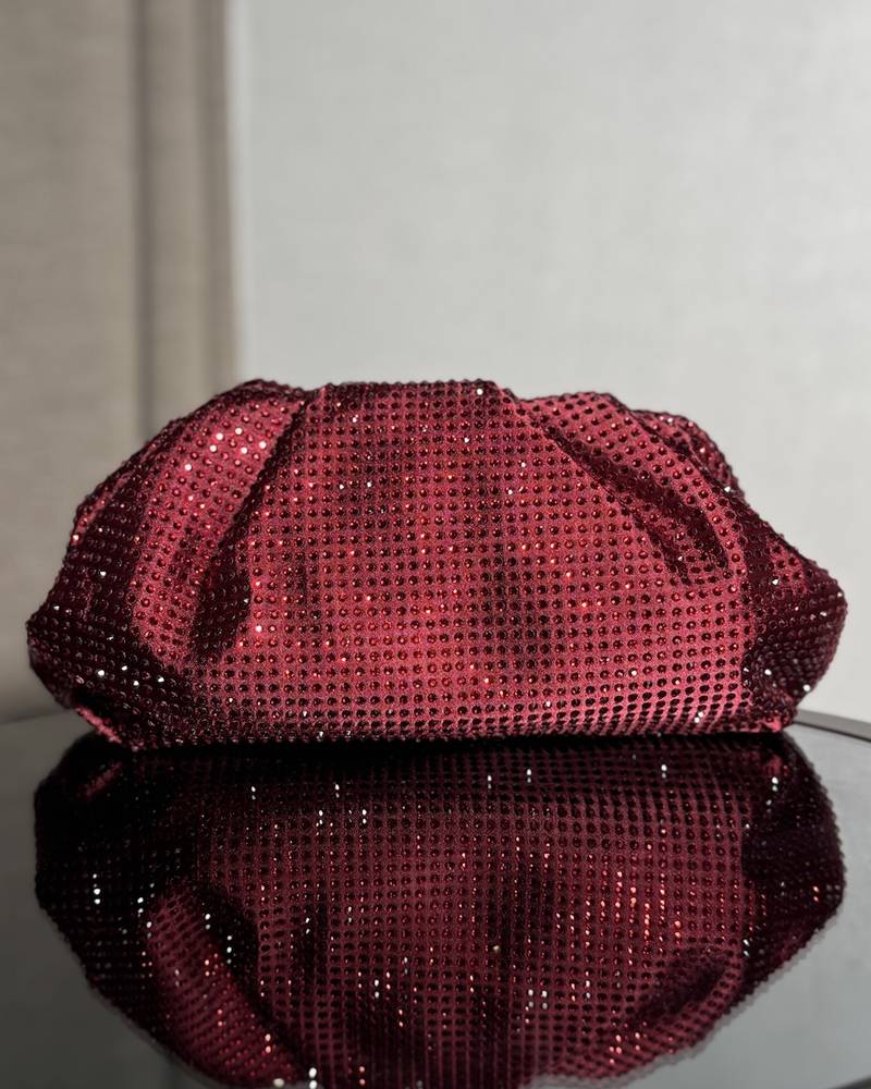 Shiny puffy clutch-style bag