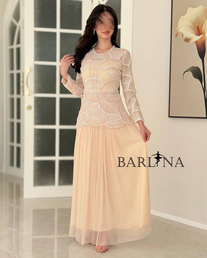 Beige dress with geometric white bead embroidery