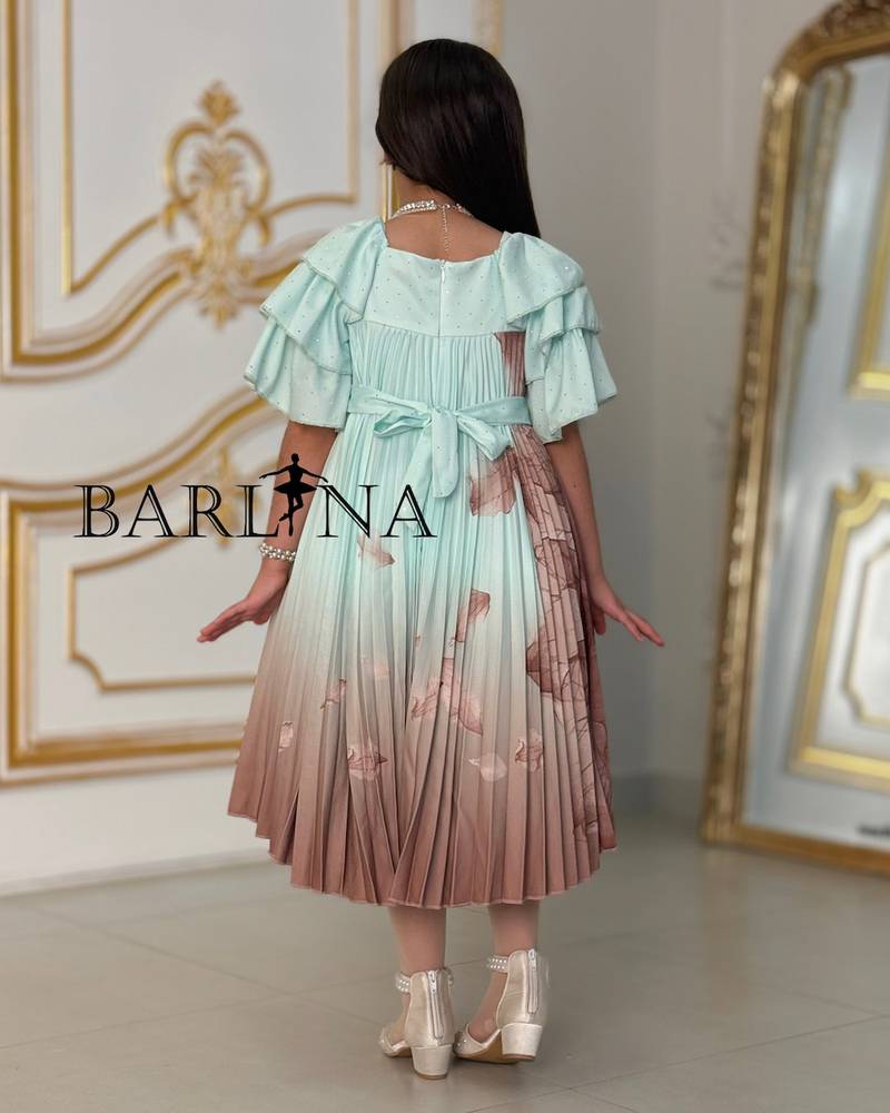 A soft girl's dress decorated with delicate prints