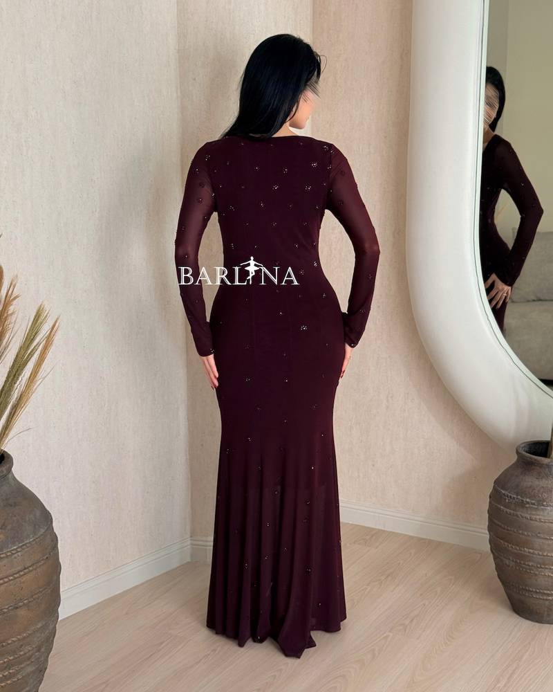 Long burgundy fitted dress with delicate embellishments