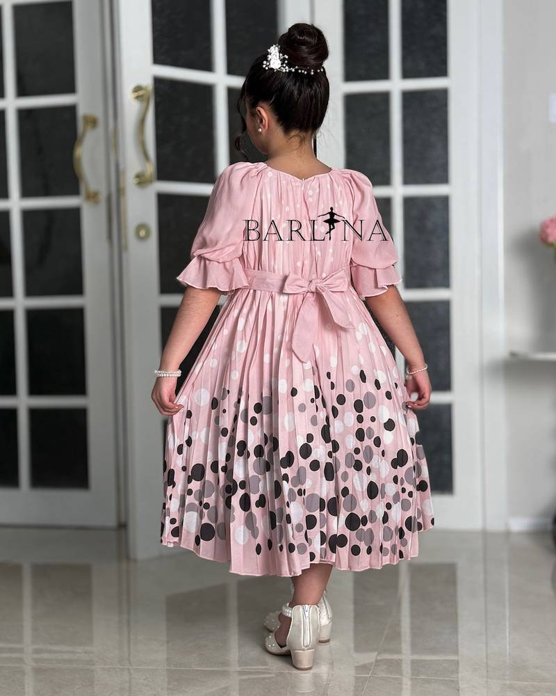 Girls' pink dress with elegant polka dot details