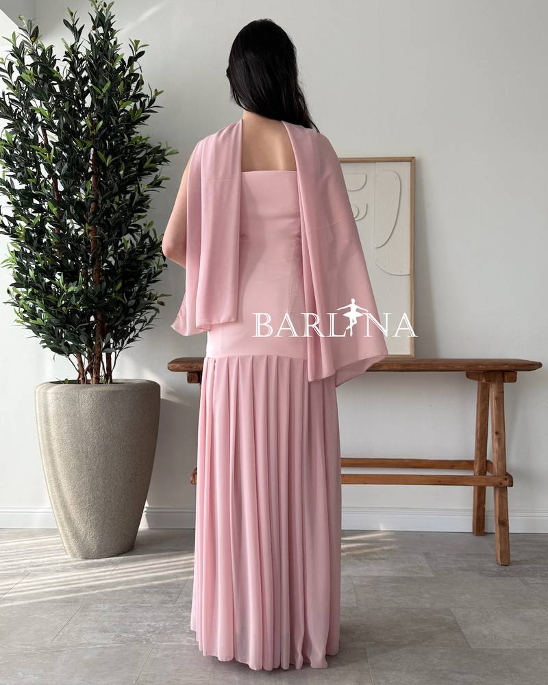 A soft pink dress with a matching shawl