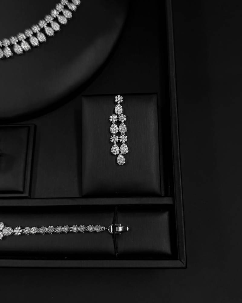 Elegant accessory set with a repeating, draped design