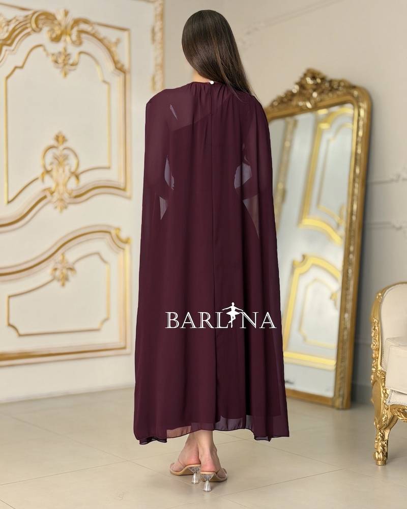 Burgundy dress with flowy shoulder cape
