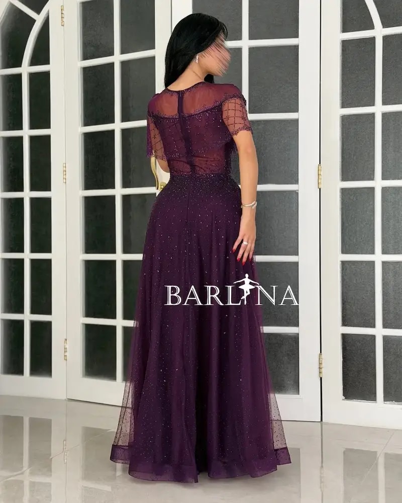 Purple tulle evening dress decorated with sequins