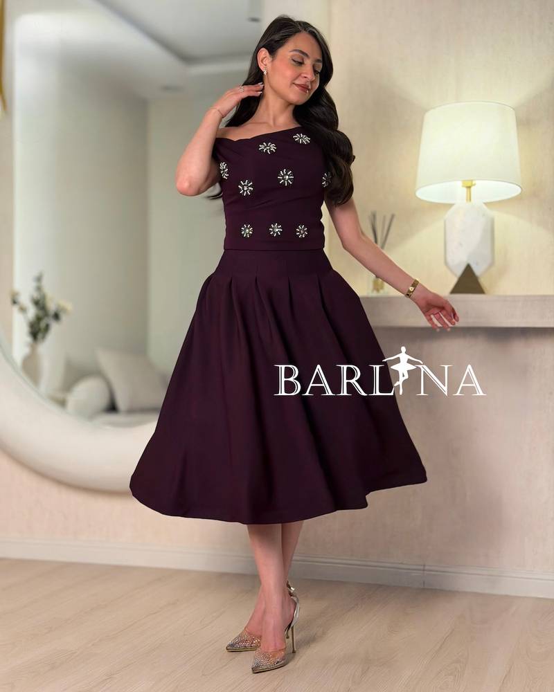 Dark purple dress with crystal embellishments