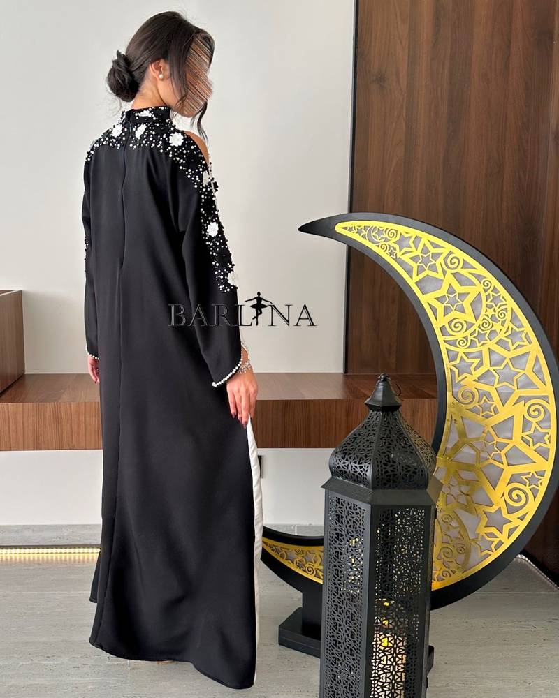 Black and white jalabiya with embroidery on the sleeves