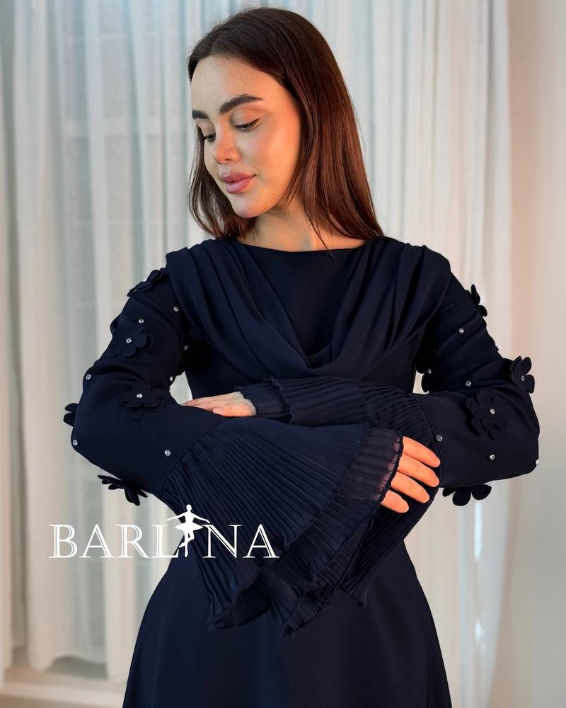 A soft navy dress with a draped collar detail