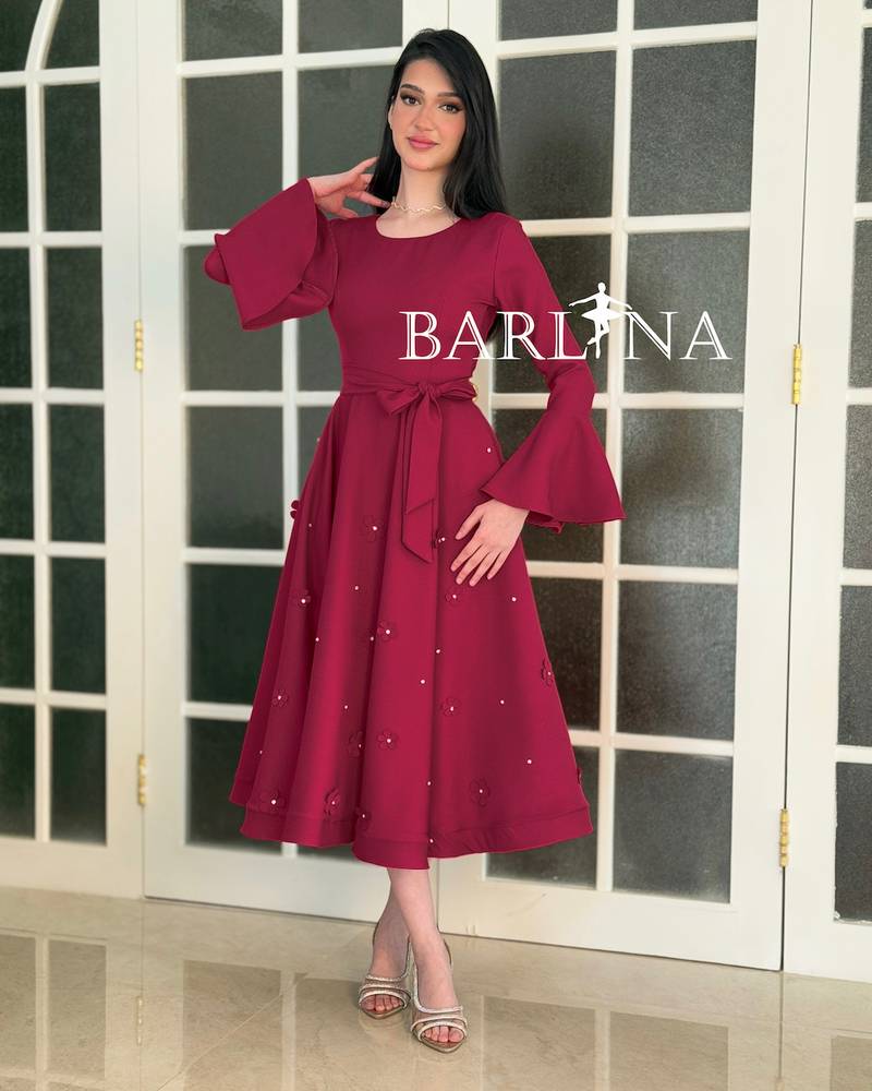 A stylish fuchsia dress with delicate embroidery