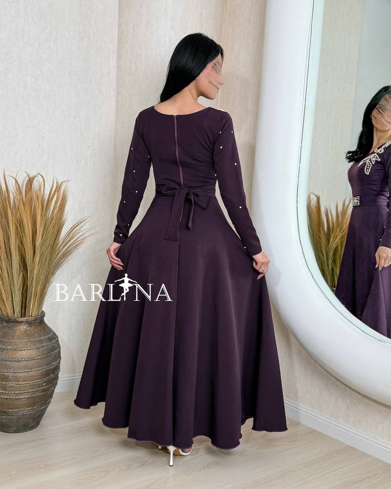 Purple dress with crystal embroidery on the chest