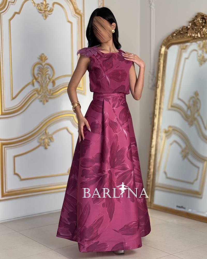 Elegant fuchsia dress with a prominent rose on the shoulder