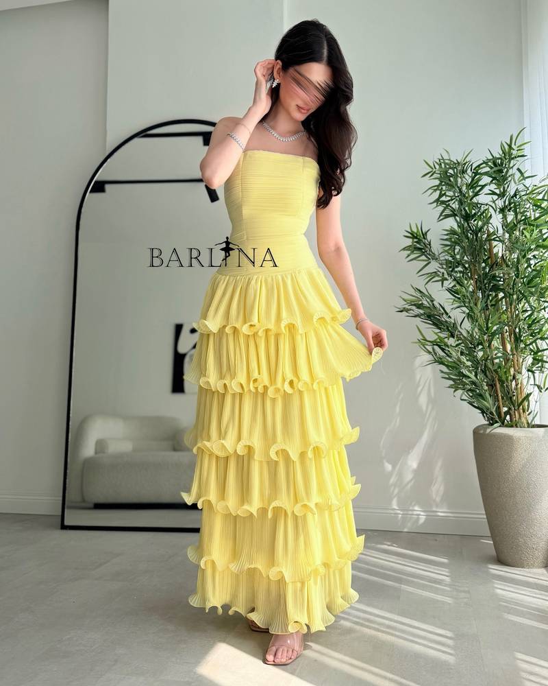 Lemon-yellow dress with ruffled layers