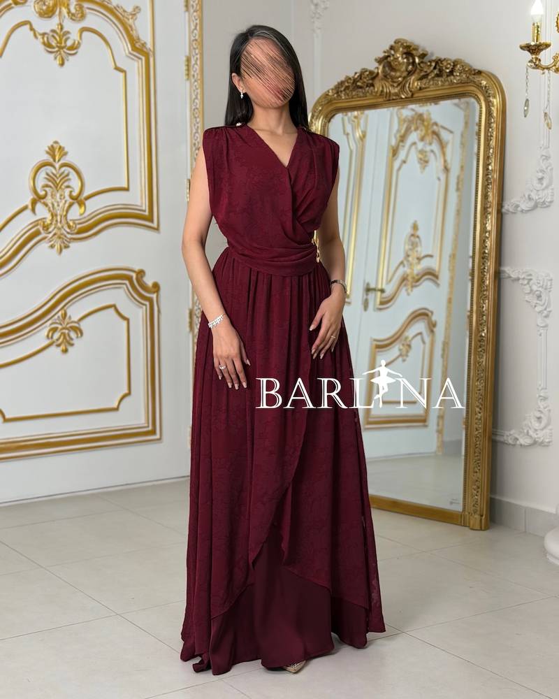 Red dress with a fitted waist and pleats