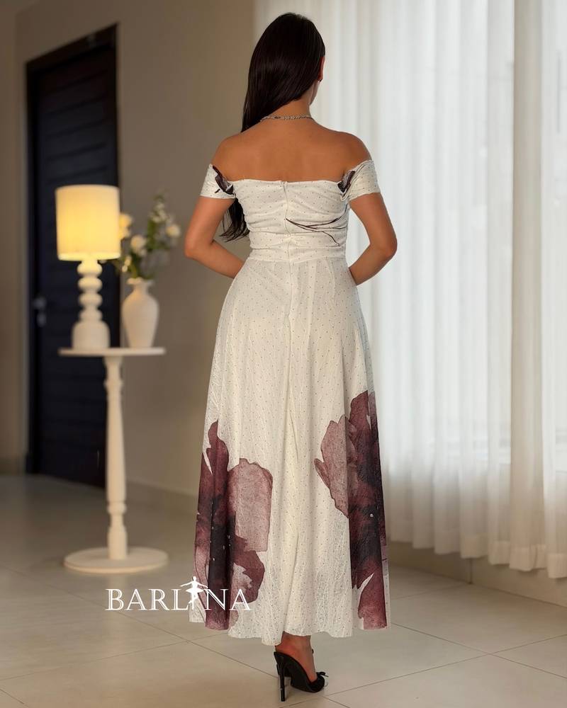 Off-white dress with a purple floral print