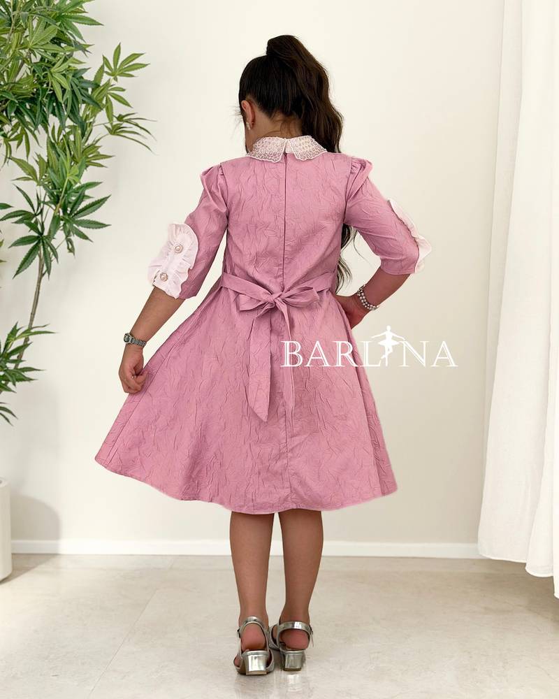 A soft, girly dress adorned with lace details.