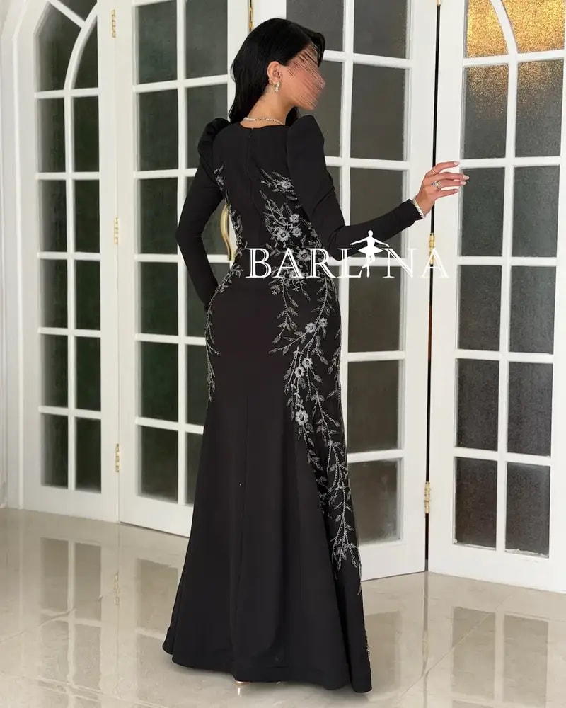 Black dress embroidered with silver details