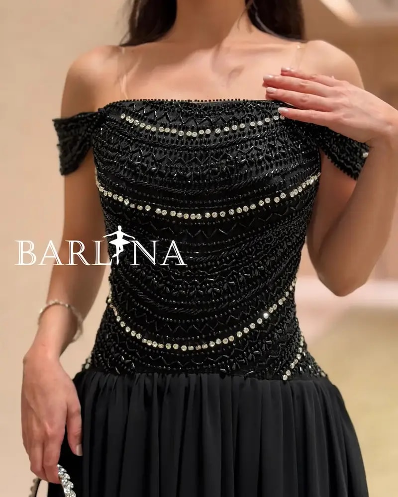 Elegant black evening dress adorned with sparkling stripes