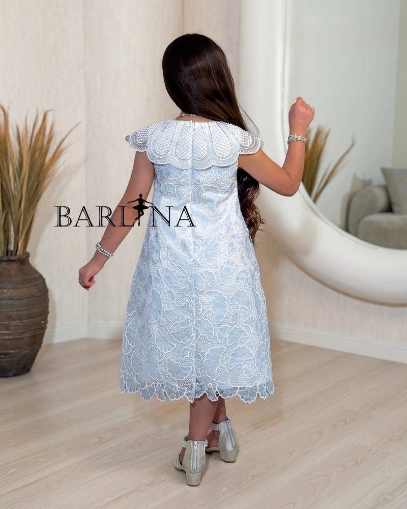 Elegant white girls' dress with a wide cut